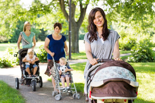 Mothers walking a trail with baby strollers